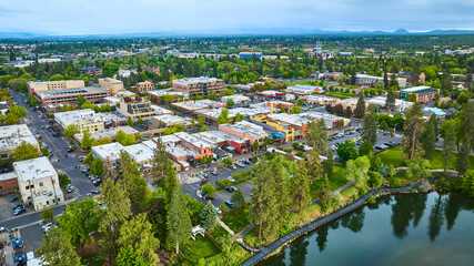 Aerial View of Bustling Suburban Town in Oregon with Green Spaces and Waterfront