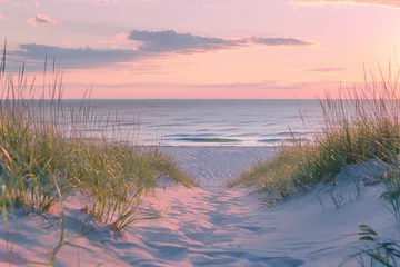 Papier peint photo Le salon A serene beach scene at sunset, with soft sand dunes and tall grasses in the foreground, leading to an unobstructed view of calm waters meeting the horizon under a pastel sky.  © Ace64 Studio