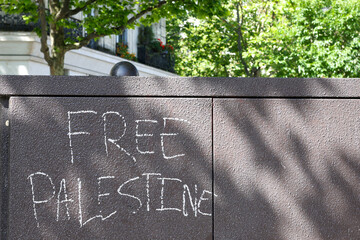 Free Palestine message written on electrical cabinet outdoors