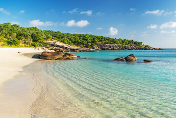Picturesque tropical golden sandy Sunset Beach with turquoise water on Lizard Island, Australia. Lizard Island  is located on Great Barrier Reef in north-east part of Queensland