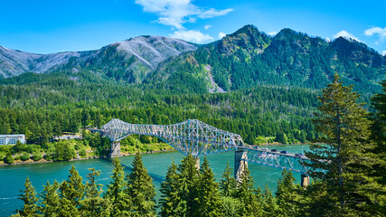 Aerial View of Bridge of the Gods Over Serene River and Lush Forest