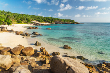 Picturesque tropical golden sandy Sunset Beach with turquoise water on Lizard Island, Australia. Lizard Island  is located on Great Barrier Reef in north-east part of Queensland