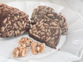 Plate with chocolate salami dessert.

