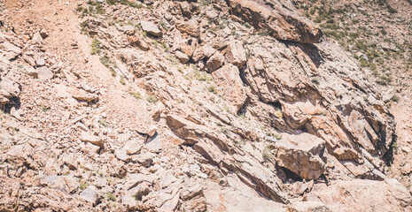 Rocky mountain range of red powerful rocks in Tien Shan mountains in Pamir