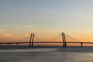 cable-stayed bridge close-up in the rays of the setting sun  
