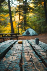 Wooden table in camping setting, surrounded by nature's beauty Rustic charm against wilderness