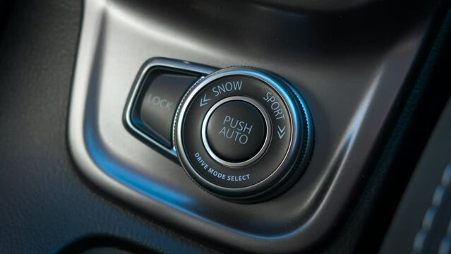 The driver presses the traction control button. The driver changes the car's traction