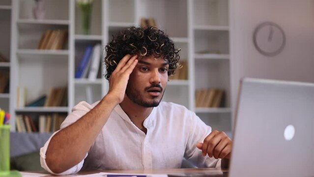  Worried young man freelancer waiting for important message with crossed fingers and reading bad negative news result feeling disappointed at home workplace Defeat Loss Disappointment 