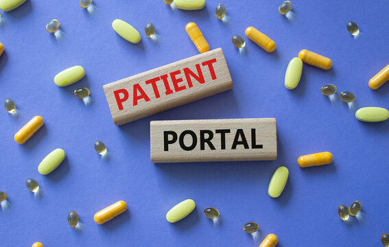 Patient Portal symbol. Concept word Patient Portal on wooden blocks. Beautiful purple background with pills. Medicine and Patient Portal concept. Copy space