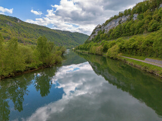 Landscape with fields, mountains and river in France near Besancon in spring, Franche-Comte