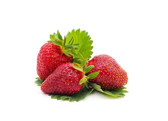 Ripe strawberry with leaves.