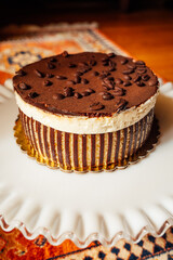 striped tiramisu cake with coffee beans on top