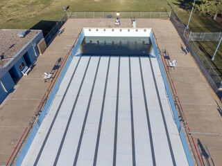 Drone view of an empty and drained winterized swimming pool 