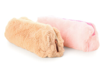 Pencil cases on white background