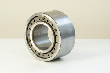 Metal ball bearing isolated on a white background, side view.  Stainless metal roller. Spare parts