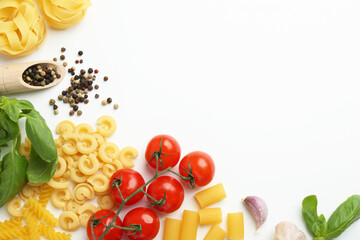 Different types of pasta, spices and products on white background, top view. Space for text