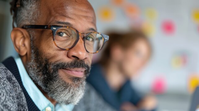 A thoughtful individual appears deep in contemplation, while a colorful background full of sticky notes suggests a creative and brainstorming environment behind him.