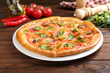 Delicious pizza Diablo and ingredients on wooden table