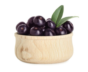 Fresh ripe acai berries in bowl and green leaves isolated on white