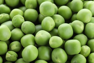 Fresh raw green peas as background, closeup