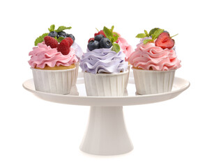 Tasty cupcakes with different berries isolated on white