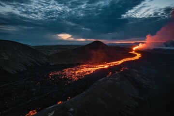 Stunning view of a volcanic eruption with flowing lava during sunset under a dramatic sky. Iceland © Wirestock