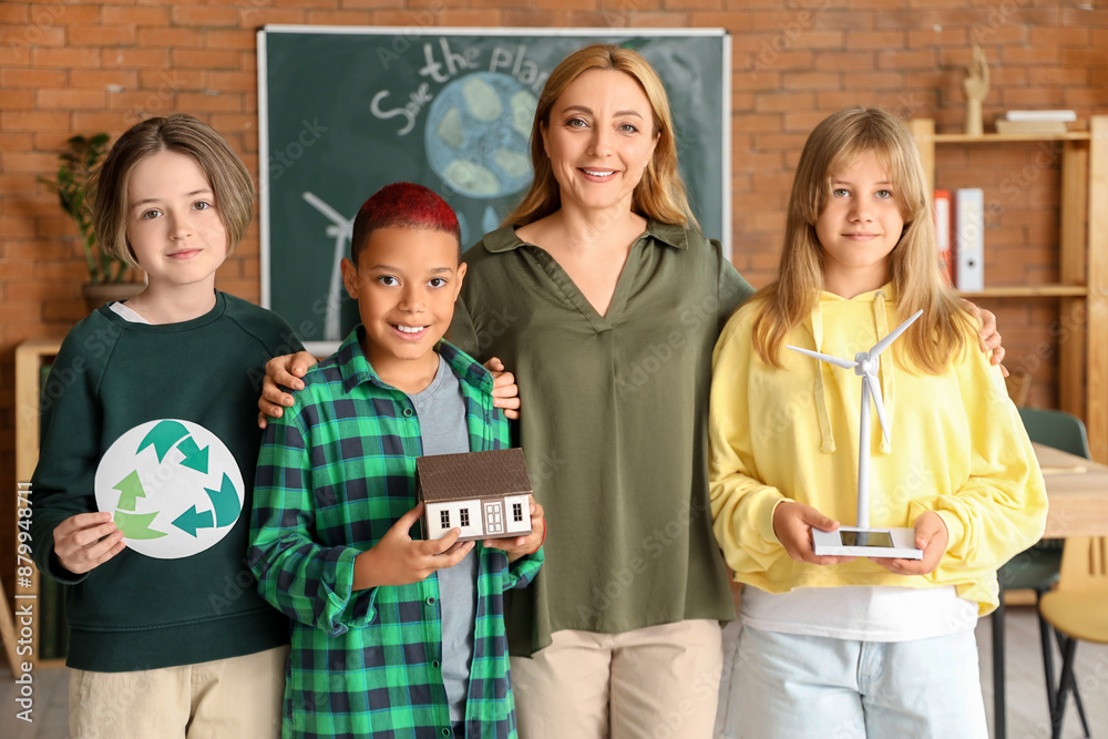 Poster Female teacher with pupils and wind turbine model in classroom. Ecology concept