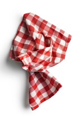 Obraz premium Red and white checkered cloth is folded up and laying on white background