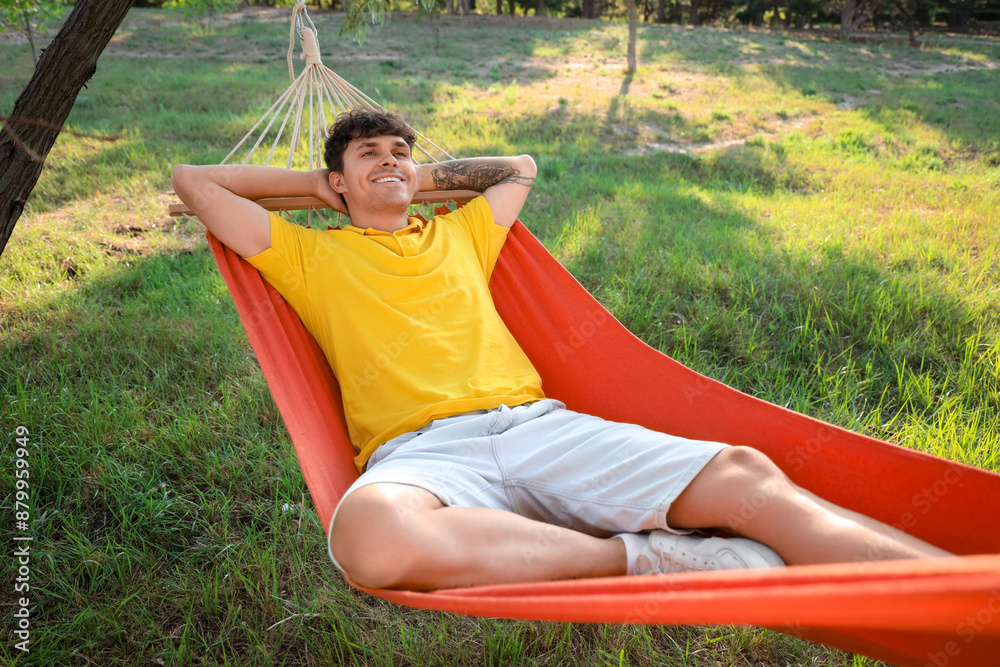 Sticker Young man resting in hammock outdoors