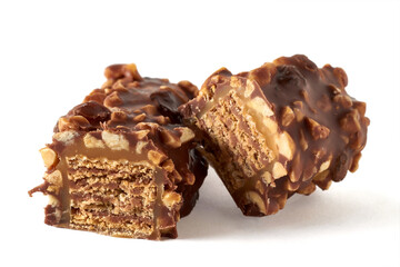 Chocolate wafer bar with caramel and peanuts in a cut isolated on a white background