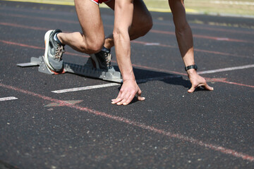 Runner On The Starting Blocks In Position 