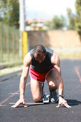 Runner On The Starting Blocks In Position 