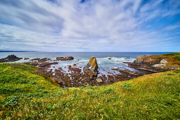 Rugged Coastal Rock Formations and Turquoise Waters at Eye Level