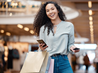 Happy woman, portrait and shopping bags with phone or credit card at mall for easy payment or ecommerce. Female person or shopper with smile on mobile smartphone in fashion, simple banking or fintech