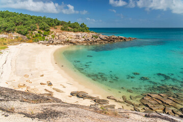 Picturesque tropical Pebbly Beach with turquoise water on Lizard Island, Australia. Lizard Island  is located on Great Barrier Reef in north-east part of Queensland