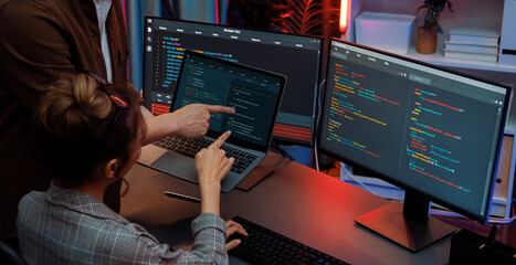 Serious of IT developers discussing intelligent website development coder system running data...