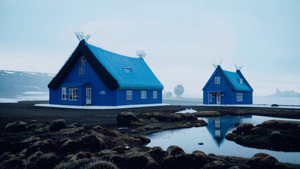 two blue houses with thatched roofs on a beach