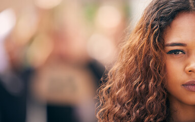 Protest, half face and portrait of woman at rally for human rights, racism or equality activism. Serious, politics and face of female person at town march for feminism or women empowerment in society