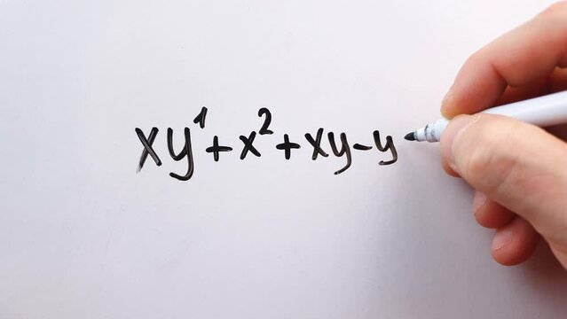 An algebraic equation written in marker on a white board. Math concepts, calculating equations.