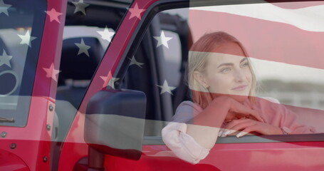 Image of flag of usa over caucasian woman by car on beach