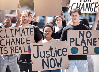 People, posters and protest in outdoor portrait, demonstration and rally for change in society....