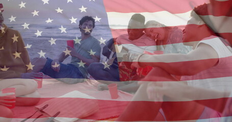 Image of flag of usa over happy diverse friends at beach party in summer