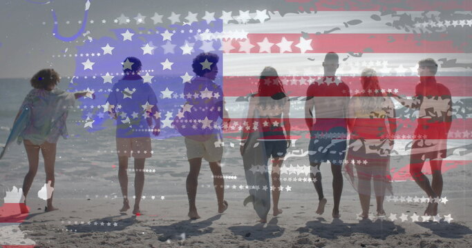 Image of flag of usa over happy diverse friends on beach in summer - Powered by Adobe