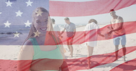 Image of flag of usa over happy diverse friends recycling on beach in summer