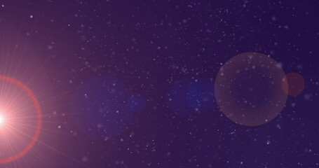 Image of falling white lights over red and blue bokeh spotlights on dark background