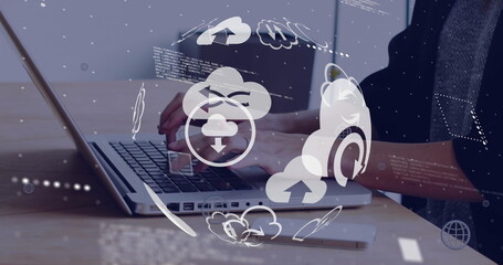 Image of globe with icons data processing over biracial man using laptop