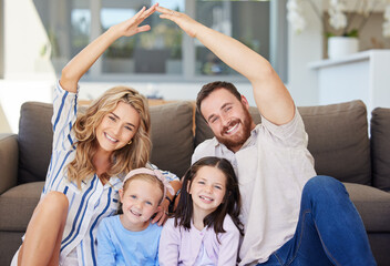 Family, portrait and home with security, protection and safety from insurance with parents and kids. Hands together, roof and smile with happy people, love and support in living room with unity sign