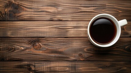 Coffee cup placed on wooden background with empty space