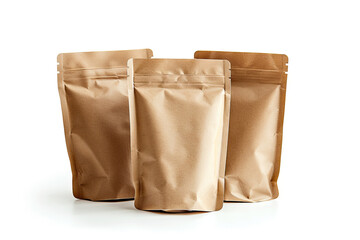  Three brown kraft paper pouches stand upright on a white background, highlighting their eco-friendly packaging design, commonly used for food, coffee, or tea storage.