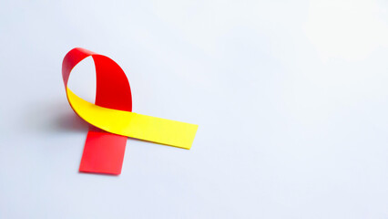 A Red and Yellow ribbon in paper cut style. World hepatitis day awareness month, 28 July, Liver...